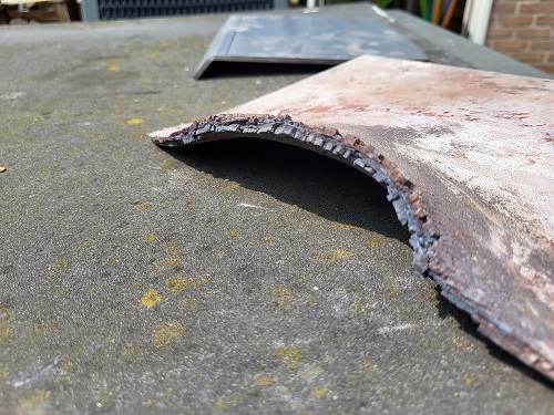 krom getrokken en afgebrokkelde vlamplaat